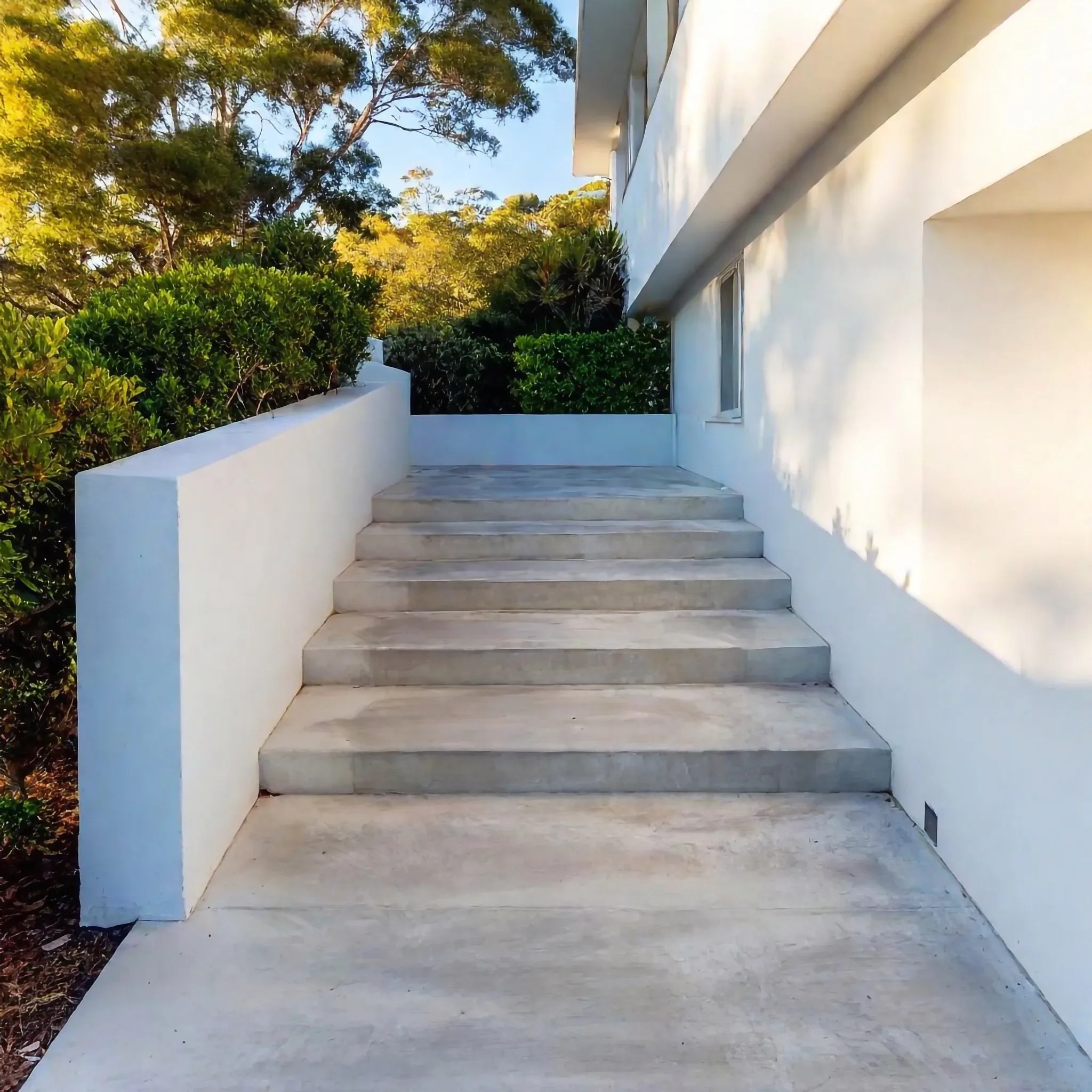 Concrete steps built for practical access around a property